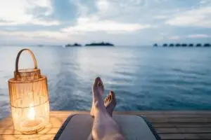 Person relaxing near the water