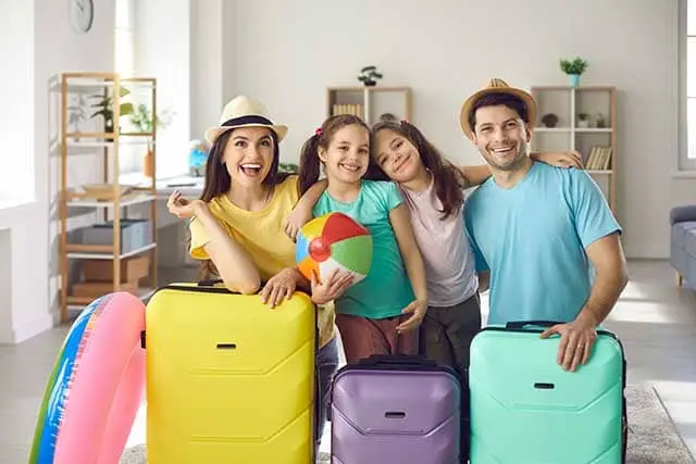 Family getting ready for vacation saving money with free extra guests promo on NCL