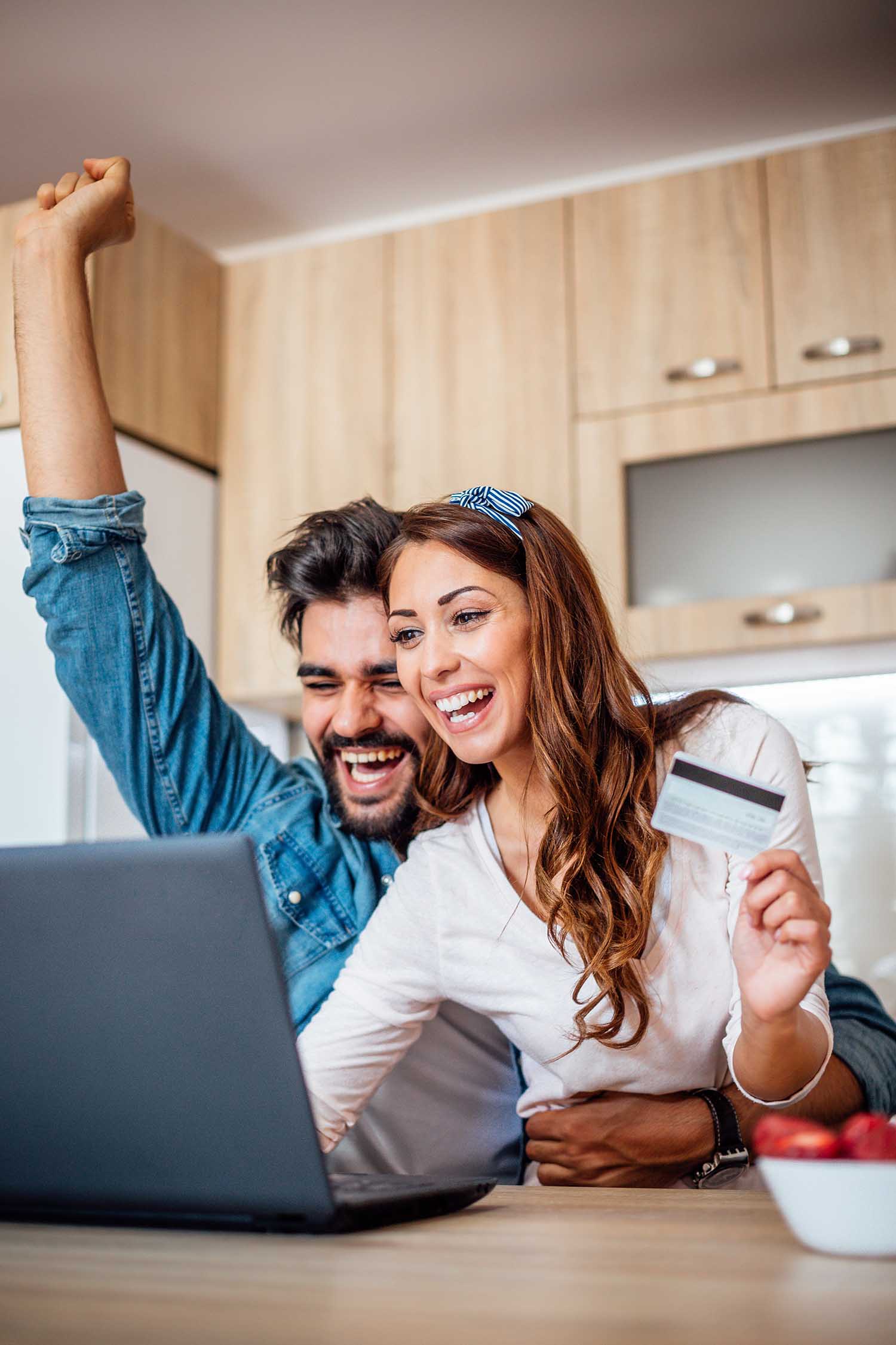 Happy couple just booked a vacation online