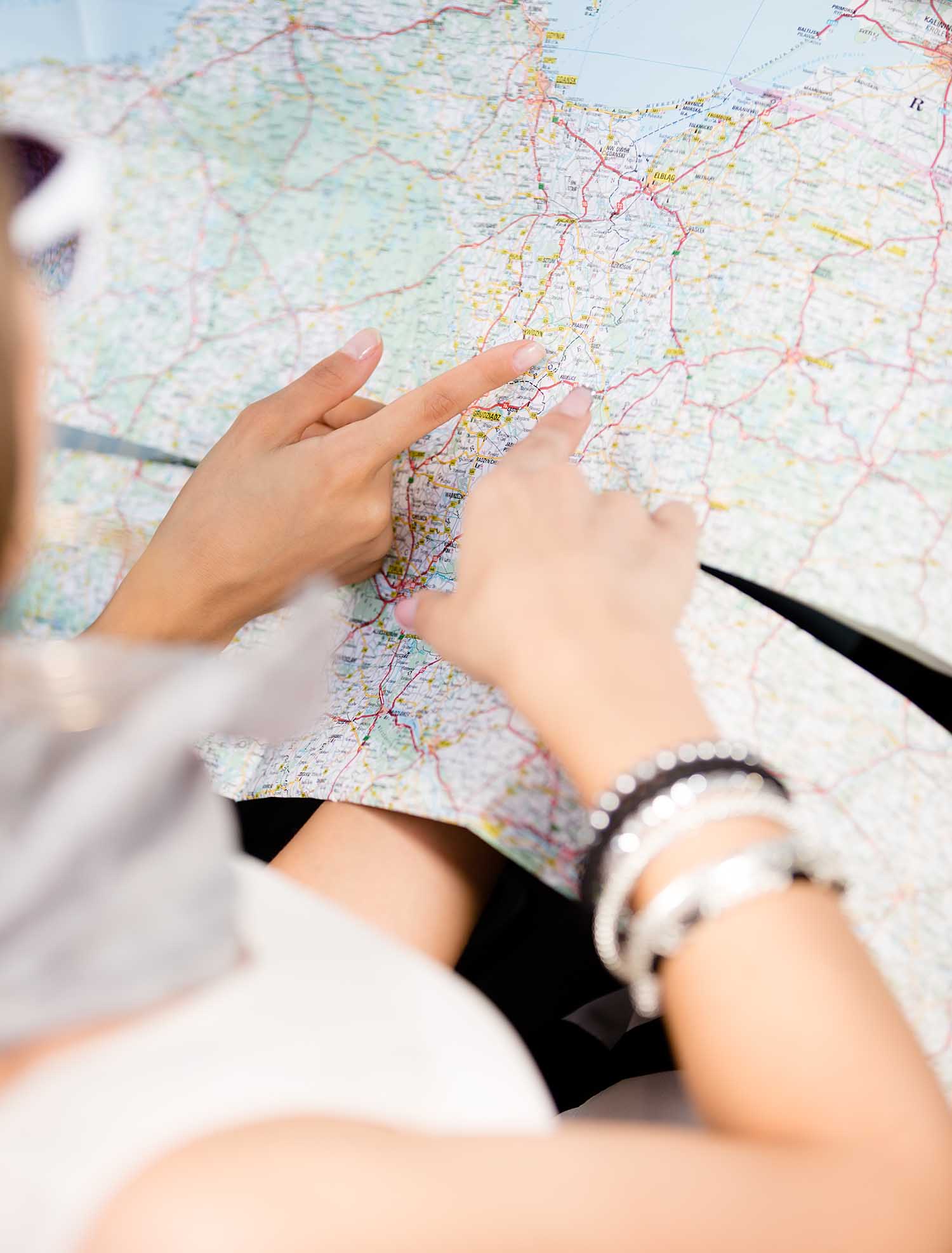 People looking at a map and planning vacation