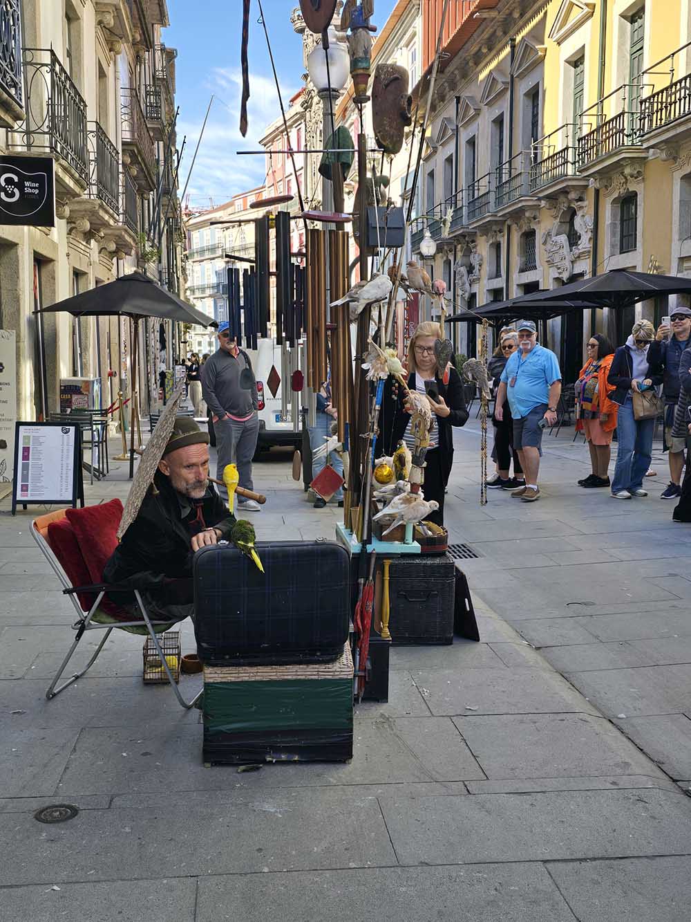 Street performer playing music in Porto