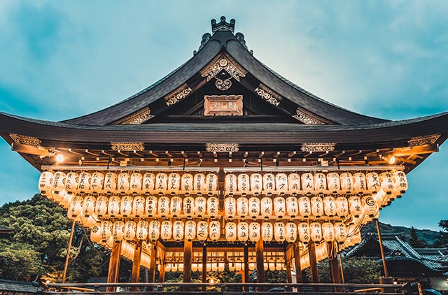 Yasaka Shrine at night with glowing paper lanterns
